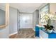 Inviting foyer featuring wood-look flooring and a stylish blue console table at 575 Sanctuary Dr # A303, Longboat Key, FL 34228