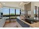 Well-lit kitchen featuring an island with a breakfast bar and a large window with scenic views at 575 Sanctuary Dr # A303, Longboat Key, FL 34228