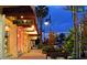 Evening view of a charming street with shops and palm trees at 575 Sanctuary Dr # A303, Longboat Key, FL 34228