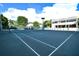 Well-maintained tennis court with surrounding landscaping at 575 Sanctuary Dr # A303, Longboat Key, FL 34228