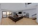Spacious living room with fireplace and access to the patio at 639 Cornwell On The Gulf, Venice, FL 34285