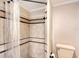 Tiled shower with stylish design features and neutral color scheme at 640 Venice Ln, Sarasota, FL 34242