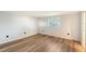 Clean bedroom with wood flooring, window, and neutral walls at 640 Venice Ln, Sarasota, FL 34242