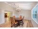 Dining room with exposed beams, natural light, and hardwood floors at 640 Venice Ln, Sarasota, FL 34242