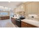 Updated kitchen boasts stone backsplash, ample storage, and stainless steel appliances at 640 Venice Ln, Sarasota, FL 34242