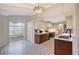 Bright kitchen features decorative tile floors, updated cabinets, and stained glass lighting fixture at 640 Venice Ln, Sarasota, FL 34242