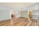 Bright living room with views into the dining area, hardwood flooring, and neutral color palette at 640 Venice Ln, Sarasota, FL 34242