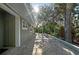 Exterior shot of stone patio under trees at 640 Venice Ln, Sarasota, FL 34242