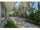 Stone patio with lush greenery providing shade and privacy at 640 Venice Ln, Sarasota, FL 34242
