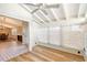 Bright sunroom with ceiling fan, wood flooring, and views of the dining area at 640 Venice Ln, Sarasota, FL 34242