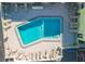 Complex aerial showing pool and surrounding patio furniture at 6703 Midnight Pass Rd # 208, Sarasota, FL 34242