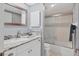 Clean bathroom with granite vanity and shower/tub combo at 6703 Midnight Pass Rd # 208, Sarasota, FL 34242