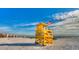 Yellow lifeguard stand on Siesta Beach with American flag at 6703 Midnight Pass Rd # 208, Sarasota, FL 34242