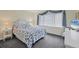 Cozy bedroom with a queen-size bed and a flat-screen TV at 6703 Midnight Pass Rd # 208, Sarasota, FL 34242