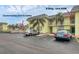Sea Winds building exterior, unit 208, with parking and pool view at 6703 Midnight Pass Rd # 208, Sarasota, FL 34242