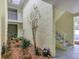 Peaceful courtyard with plants and stairs leading to upper levels at 6703 Midnight Pass Rd # 208, Sarasota, FL 34242