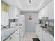 Modern kitchen with white cabinets and granite countertops at 6703 Midnight Pass Rd # 208, Sarasota, FL 34242