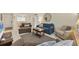 Bright living room with ample seating and a view of the dining area at 6703 Midnight Pass Rd # 208, Sarasota, FL 34242