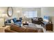 Spacious living room with comfortable sofas and a large TV at 6703 Midnight Pass Rd # 208, Sarasota, FL 34242
