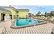 Inviting community pool with plenty of lounge chairs at 6703 Midnight Pass Rd # 208, Sarasota, FL 34242