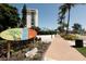 Siesta Key Village entrance sign with building and pathway at 6703 Midnight Pass Rd # 208, Sarasota, FL 34242