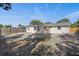 Large backyard with a patio and wooden fence at 7720 Judith Cres, Port Richey, FL 34668