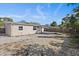 Large backyard with a patio and wooden fence at 7720 Judith Cres, Port Richey, FL 34668