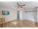 Bright bedroom with wood-look floors and ceiling fan at 7720 Judith Cres, Port Richey, FL 34668