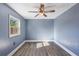 Bright bedroom with ceiling fan and light gray walls at 7720 Judith Cres, Port Richey, FL 34668