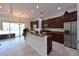 Modern kitchen with stainless steel appliances and granite countertops at 931 Mangrove Edge Ct, Bradenton, FL 34208