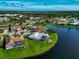 Aerial view of a residential area featuring lakefront homes at 1200 Covey Ct, Venice, FL 34293