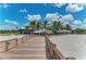 Boardwalk leads to a beach bar with palm trees at 12252 Stuart Dr, Venice, FL 34293