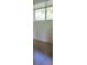 Bedroom with tile flooring and a window view at 1313 54Th E Ave # 1313, Bradenton, FL 34203