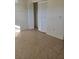 Bedroom with built-in closet and tile floors at 1313 54Th E Ave # 1313, Bradenton, FL 34203