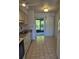 Kitchen with view to screened patio from dining area at 1313 54Th E Ave # 1313, Bradenton, FL 34203