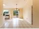 Dining area with tile floors, sliding glass doors to backyard, and chandelier at 13335 Prestwick Dr, Riverview, FL 33579