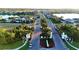 Aerial view of Canoe Creek, showcasing its community layout, landscaping, and lake features at 13930 Old Creek Ct, Parrish, FL 34219