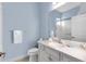 Small bathroom with toilet, sink, and white cabinets at 13930 Old Creek Ct, Parrish, FL 34219