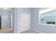 Light blue bedroom with double door closet and window at 13930 Old Creek Ct, Parrish, FL 34219