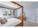 Main bedroom with a wooden canopy bed and dresser at 13930 Old Creek Ct, Parrish, FL 34219
