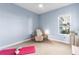Relaxing bedroom with neutral tones and a comfortable recliner at 13930 Old Creek Ct, Parrish, FL 34219