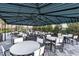 Large covered pavilion with multiple tables and chairs at 13930 Old Creek Ct, Parrish, FL 34219