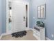 Bright and airy entryway with a white door and decorative mirror at 13930 Old Creek Ct, Parrish, FL 34219