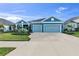 Two-story home with two car garage and well manicured lawn at 13930 Old Creek Ct, Parrish, FL 34219