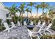 Community fire pit surrounded by white Adirondack chairs at 13930 Old Creek Ct, Parrish, FL 34219