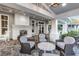 Relaxing patio with fireplace and wicker seating at 13930 Old Creek Ct, Parrish, FL 34219
