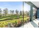 Relaxing screened porch with backyard and pond views at 13930 Old Creek Ct, Parrish, FL 34219