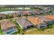 Aerial view of house and neighborhood with golf course views at 15415 Derna Ter, Bradenton, FL 34211