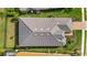 Top-down view of a house with gray tile roof and landscaping at 15415 Derna Ter, Bradenton, FL 34211