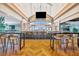 Modern bar with a long counter, comfortable seating, and large screens at 15415 Derna Ter, Bradenton, FL 34211